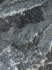 Stone close-up, textured picture, background, colored stone after the rain