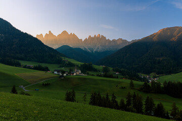 View above the Villnößtal Val di Funes with view on the Geislerspitzen Odlegruppa during sunrise...
