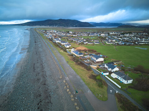 Aerial view of Fairbourne, a coastal village threatened by sea level rise and coastal erosion, North Wales, UK