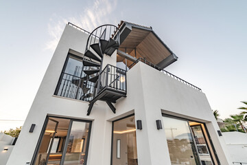 an image of a newly refurbished Mediterranean villa real estate during sunset in Marbella 