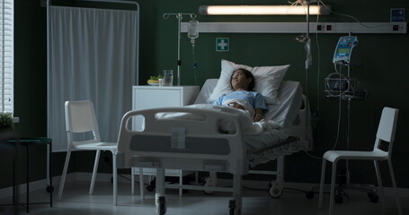 Man and a woman enter the intensive care unit to see their daughter recovering from surgery.