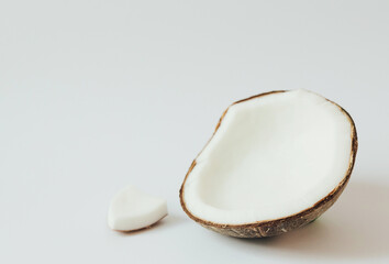 Fresh coconut on white background. Healthy raw food, dessert without sugar and flour. The concept of zero waste, pesticide-free and eco-friendly