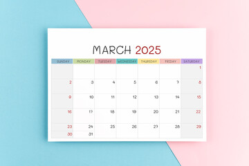 March 2025 calendar page on blue and pink background.