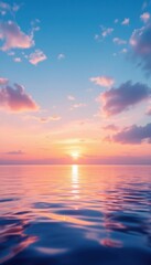 Obraz premium Tranquil ocean sunset with vibrant pink and orange clouds reflected on water