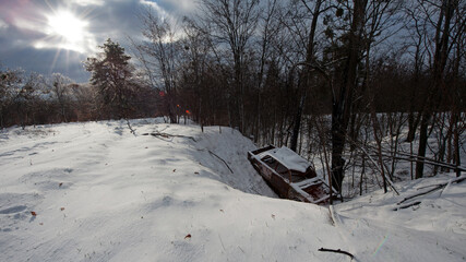 Accident on a winter snowy track. car skidding and falling into a ditch due to ice. Safety and poor...