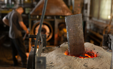 Foundry - ferrous metal is melted in an induction furnace of metallurgical plant