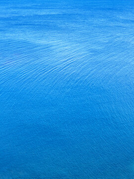 Blue sea water rippled surface.
