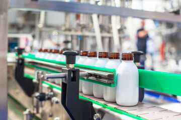 Automated assembly line for bottling and packaging liquid products in a modern industrial facility