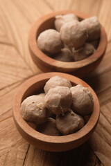 beef meatballs in a wooden bowl. bakso sapi.