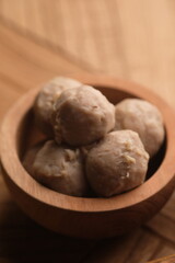 beef meatballs in a wooden bowl. bakso sapi.