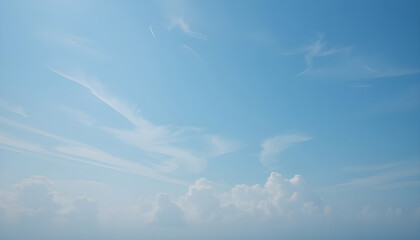 Light and airy clouds against a vibrant blue sky