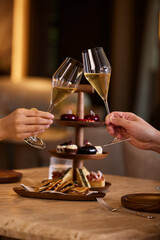 person holding a glass of champagne