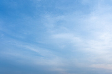 Serene Blue Sky with Wispy Clouds Calm Weather Natural Background Image