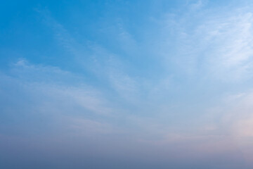 Serene Blue Sky with Wispy Clouds Peaceful Dawn or Dusk Atmosphere Nature Background