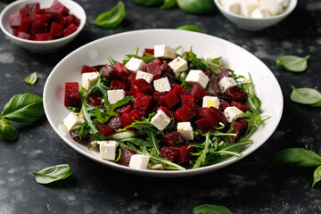 Fresh Beetroot feta salad with wild rocket and lemon dressing. Healthy food.