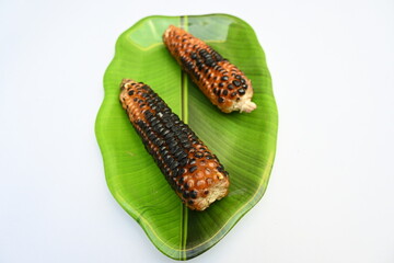 Grilled Sweet corn cob on whitebackground. This is a complete food for humans. It contains many vitamins. It's like all over world. Heathy eating. 