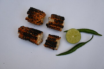 Grilled Sweet corn cob on whitebackground. This is a complete food for humans. It contains many vitamins. It's like all over world. Heathy eating. 