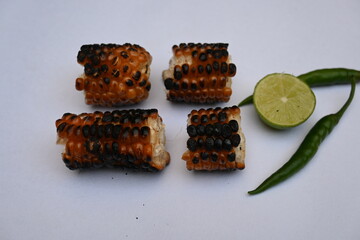 Grilled Sweet corn cob on whitebackground. This is a complete food for humans. It contains many vitamins. It's like all over world. Heathy eating. 