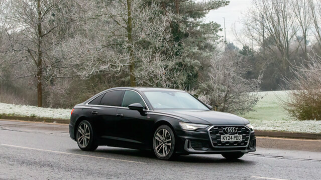 Milton Keynes,UK - Jan 12th 2025: 2024 Audi A6 hybrid electric  car driving on a cold,frosty morning