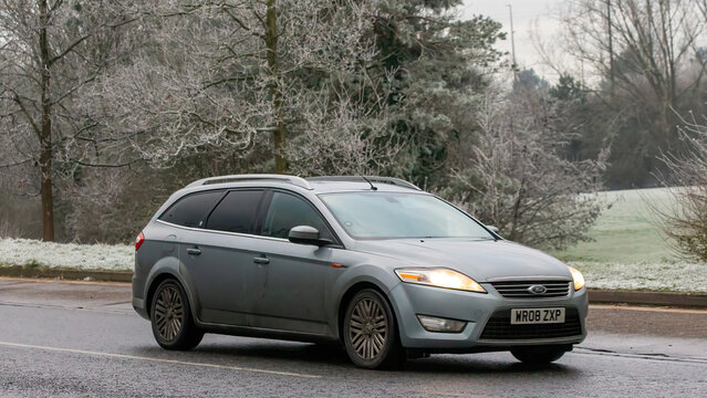Milton Keynes,UK - Jan 12th 2025: 2008 Ford Mondeo estate car driving on a cold,frosty morning