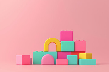 Colorful building blocks arranged creatively on a pink background for playful learning.