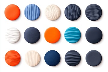 Fototapeta premium Collection of round buttons in various colors and textures arranged on a white background