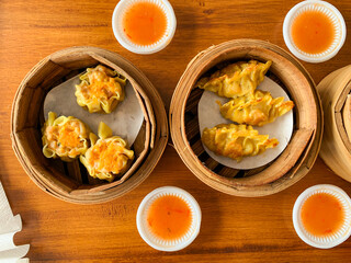 Shumai or Dimsum in a bamboo steamer bowl. Chinese food menu.