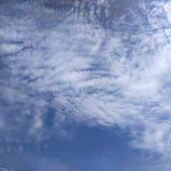 White clouds against blue sky background