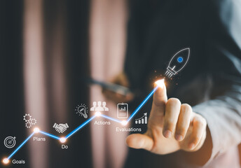 Businessman touch on investment in rocket launch growth, planning and startup of target company value goal development leader and target customer group. © Father_Studio
