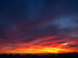 Dusk, Sunset Sky Clouds in the Evening with colorful Orange, Yellow, Pink and red sunlight and Dramatic storm clouds on Twilight sky, Landscape horizon