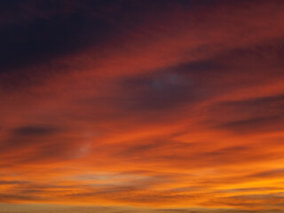 Dusk, Sunset Sky Clouds in the Evening with colorful Orange, Yellow, Pink and red sunlight and Dramatic storm clouds on Twilight sky, Landscape horizon