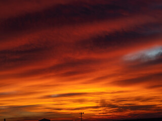 Dusk, Sunset Sky Clouds in the Evening with colorful Orange, Yellow, Pink and red sunlight and Dramatic storm clouds on Twilight sky, Landscape horizon
