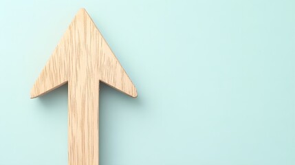 Obraz premium Realistic Close-Up of a Wooden Arrow Pointing Upward on Surface