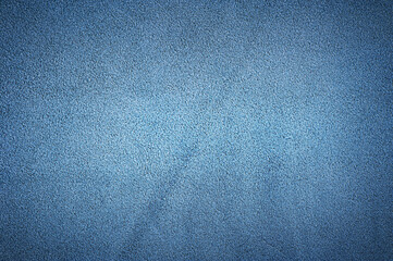 Blue suede genuine leather as a background macro photo.