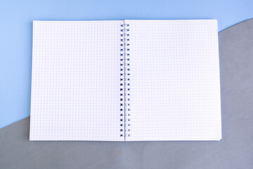 Open mockup notepad on color background, copy space for the text