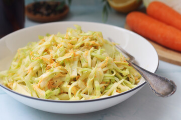 A bowl with coleslow salad	