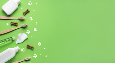 Pet grooming supplies and toothbrushes on green background