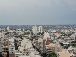 View of the city and tall buildings from the tower of the Cardinales Cofico complex. Rainy