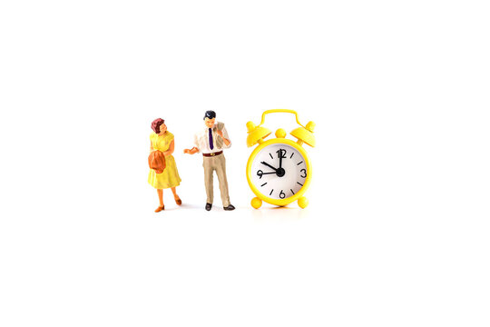 man holding clock