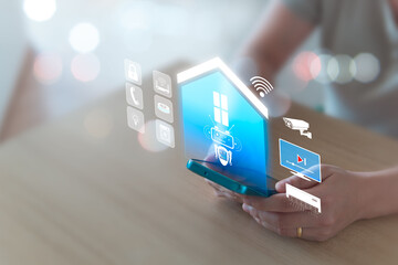 Smart home concept, remote control via mobile phone, Wi-Fi, AI assistant robot to control appliances and protect all connected systems in the home intelligently. Women use mobile phones to control.