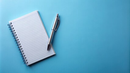 A lined notepad with a silver pen on a light blue background, ready for note-taking and capturing ideas.