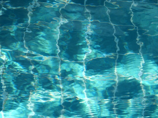 Swimming pool with crystal clear green water.