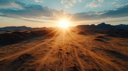Fototapeta premium A stunning landscape captured at sunrise, showcasing vast desert terrain illuminated by golden sunlight, evoking feelings of peace and tranquility.