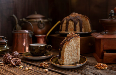 Tasty homemade cake Anthill with chocolate icing and walnuts