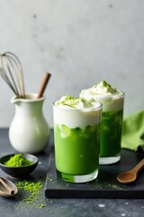 Refreshing Iced Matcha Latte with Creamy Topping and Powder