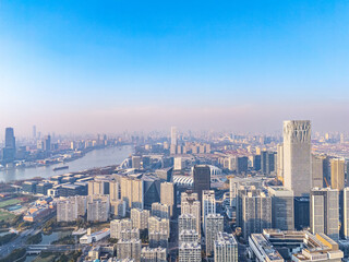 Fototapeta premium Aerial view of New bund and Shanghai Oriental Sports Center at sunset