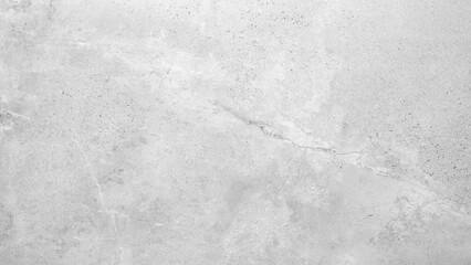 Obraz premium A grey wall with a grey background. The wall is made of concrete and has a rough texture white gray rough texture background as banner