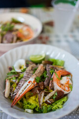 A bowl of special food of dry egg yellow noodle with crawfish, shrimp and crab, sold in Chanthaburi province, Thailand