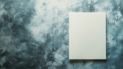 Blank canvas on textured blue wall background