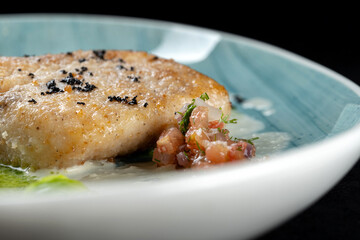 Indulge in a gourmet dish of PanSeared Fish topped with a Fresh Herb Sauce and beautiful Garnishes. Macro